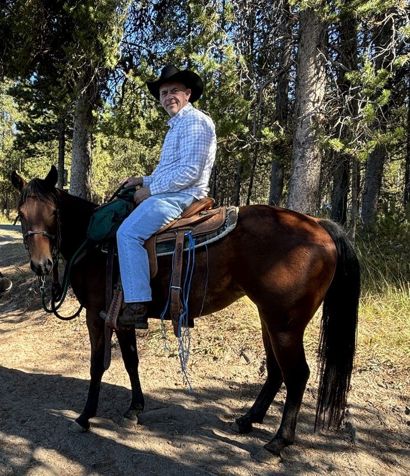 Brian on horseback in the mountains
